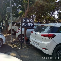 Boys parking at entrance of college